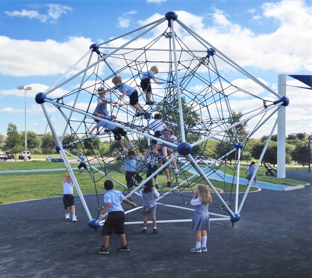 TVS children enjoying themselves on the new, customized Playground Sphere